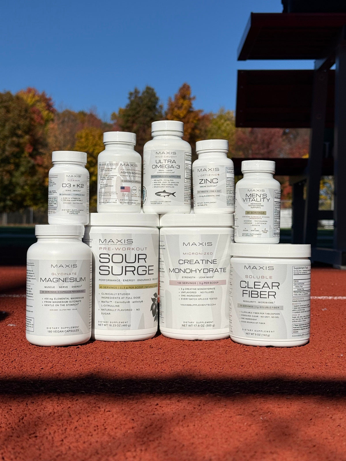 The MAXIS lineup stacked on a red running track