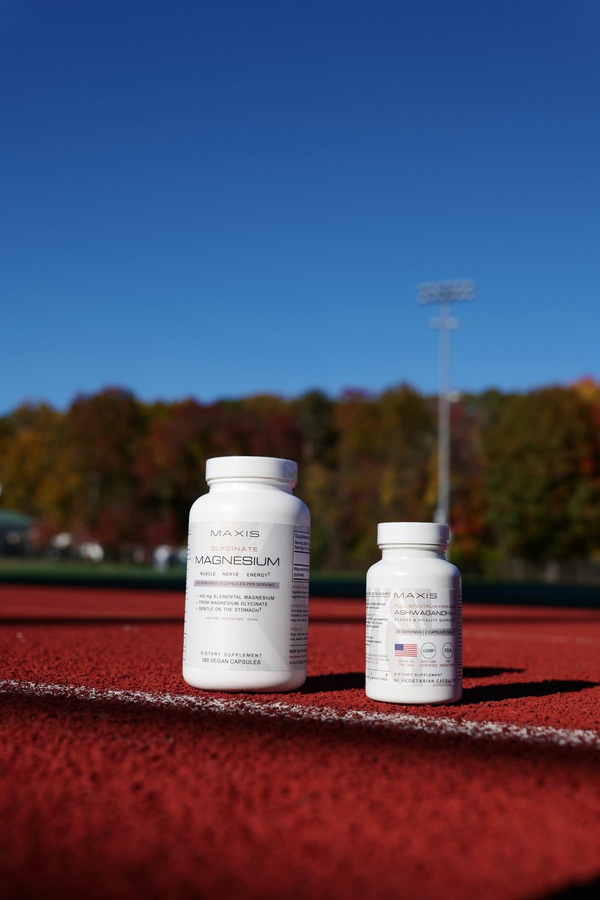 MAXIS Ashwagandha+ and Magnesium Glycinate on a running track